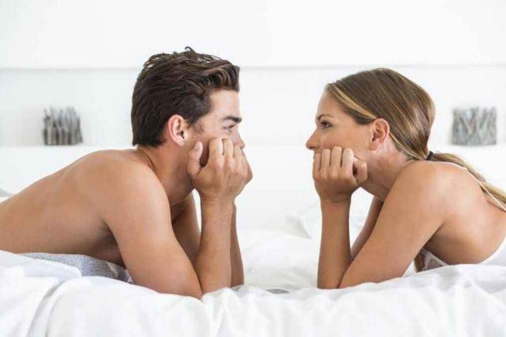 woman in bed with man with enlarged penis
